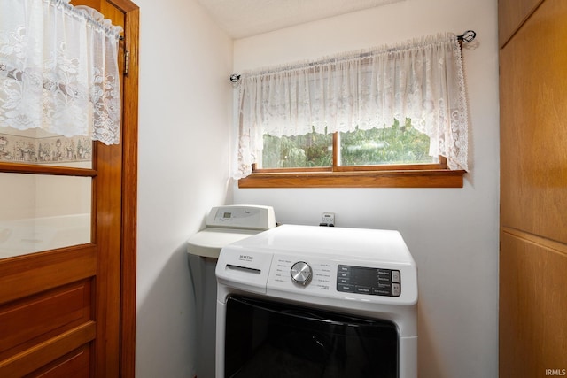 laundry room with washer / dryer