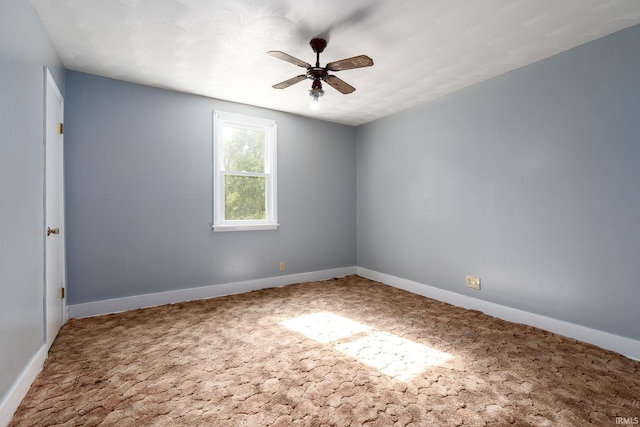 empty room featuring carpet and ceiling fan