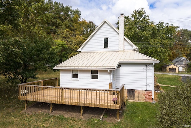 back of property featuring a wooden deck