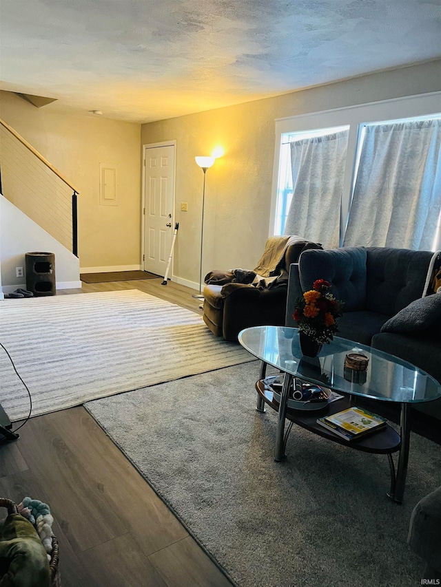 living room featuring hardwood / wood-style floors and a textured ceiling