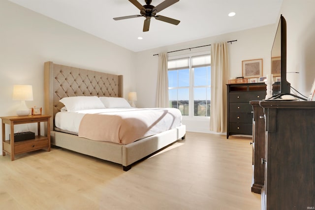 bedroom with light wood-type flooring and ceiling fan