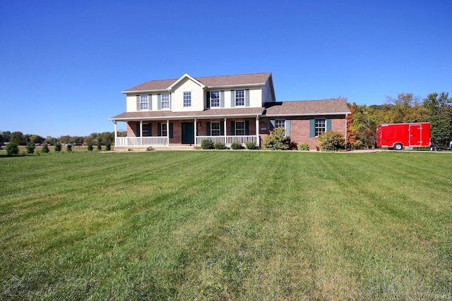 view of front facade with a porch and a front lawn