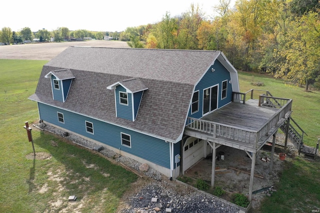 exterior space featuring a yard and a wooden deck