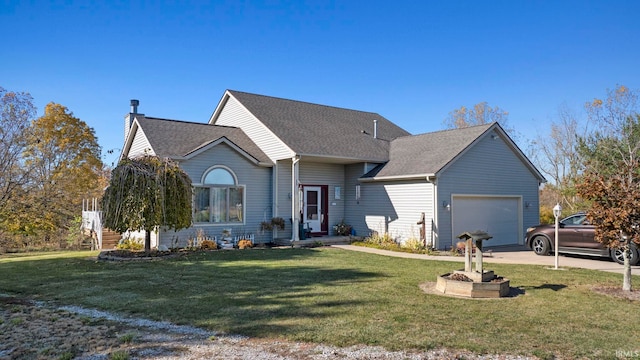 view of front of property with a garage and a front lawn