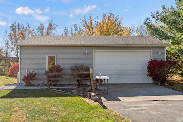 garage featuring a lawn