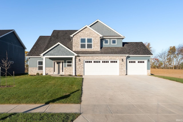 craftsman-style house with a garage and a front lawn