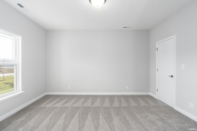 spare room with light carpet