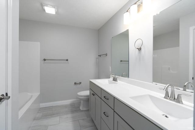 full bathroom featuring toilet, plus walk in shower, a textured ceiling, and vanity