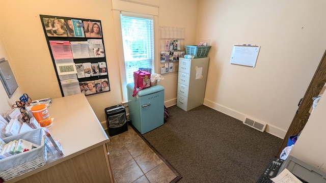 home office featuring tile patterned flooring