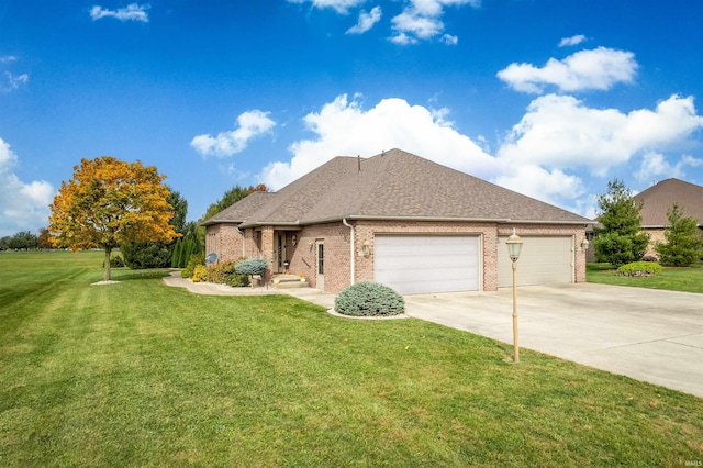 view of front of home with a front lawn and a garage