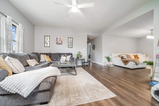 living room featuring hardwood / wood-style floors and ceiling fan