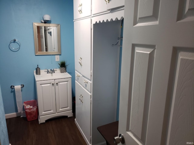 bathroom featuring vanity and hardwood / wood-style flooring