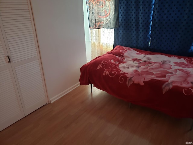 bedroom featuring hardwood / wood-style flooring