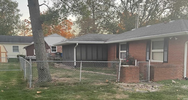 4116 N Lancaster Dr, Muncie, IN 47304 - rear view of house featuring a lawn, fence private yard, and brick siding
