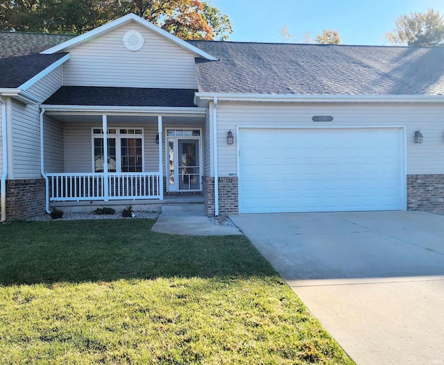 single story home with a front lawn, covered porch, and a garage