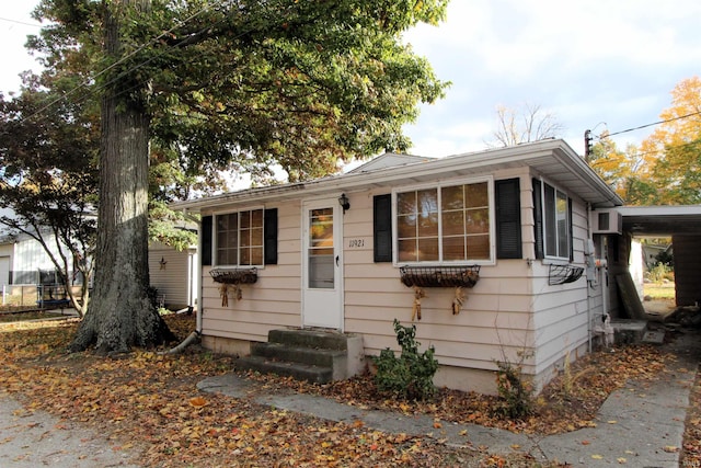 bungalow-style house with a carport