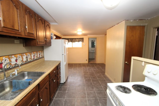 kitchen with white appliances and sink