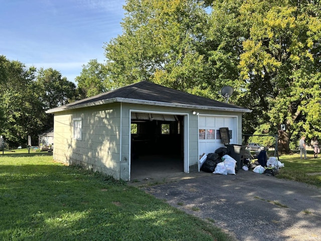 garage featuring a lawn