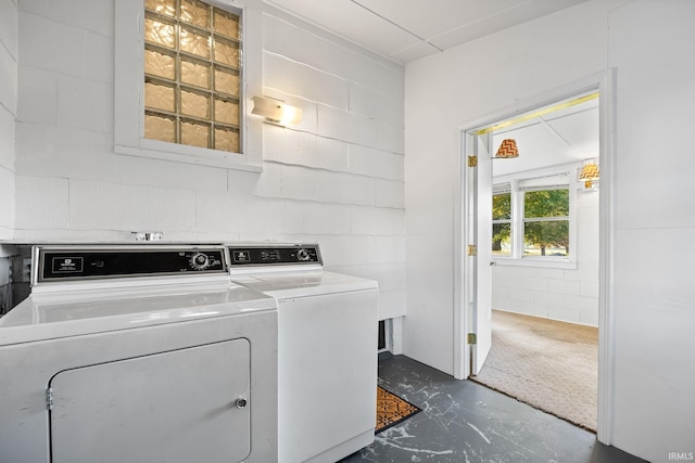 washroom with washing machine and clothes dryer