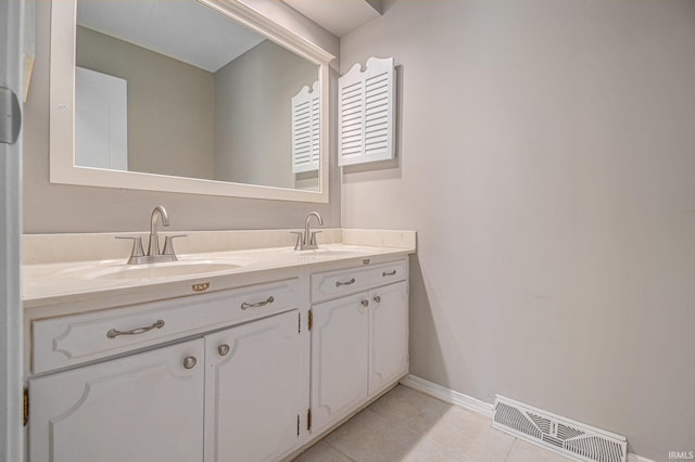 bathroom with vanity and tile patterned flooring