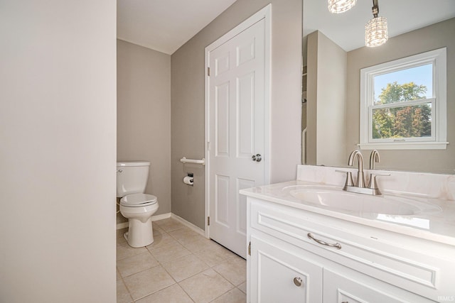 bathroom featuring vanity, toilet, and tile patterned floors