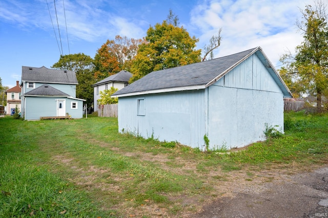 view of outbuilding with a lawn