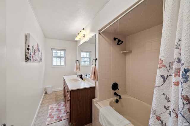 full bathroom featuring toilet, tile patterned flooring, shower / tub combo with curtain, vanity, and a textured ceiling