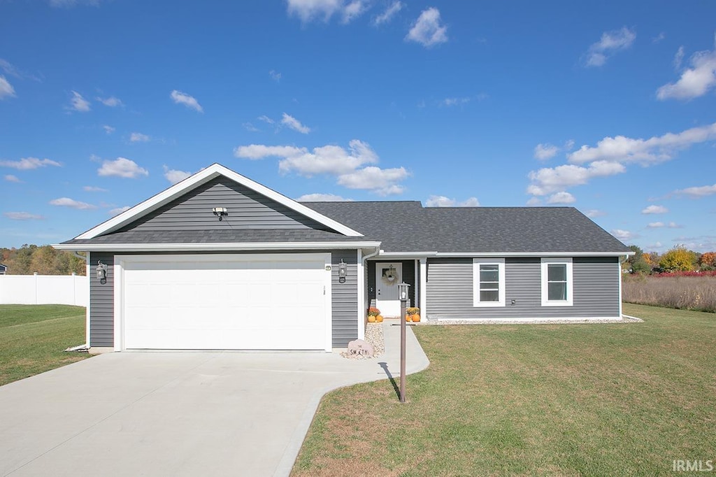 ranch-style house with a front lawn and a garage