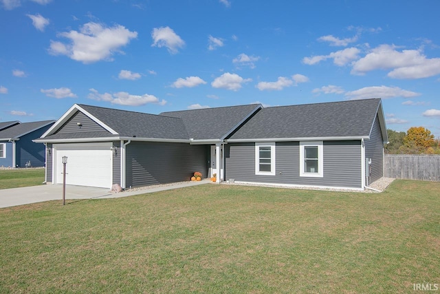 ranch-style home featuring a front lawn and a garage