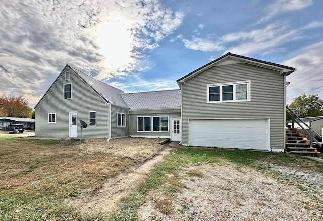 back of house with a garage