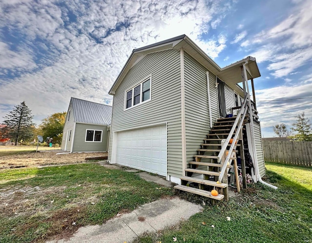 view of side of property with a garage