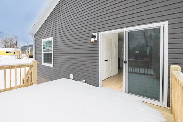 view of snow covered deck