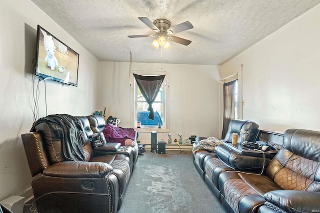 carpeted living room with a textured ceiling and ceiling fan