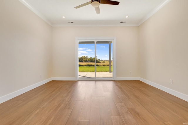 spare room with ceiling fan, ornamental molding, and light wood-type flooring