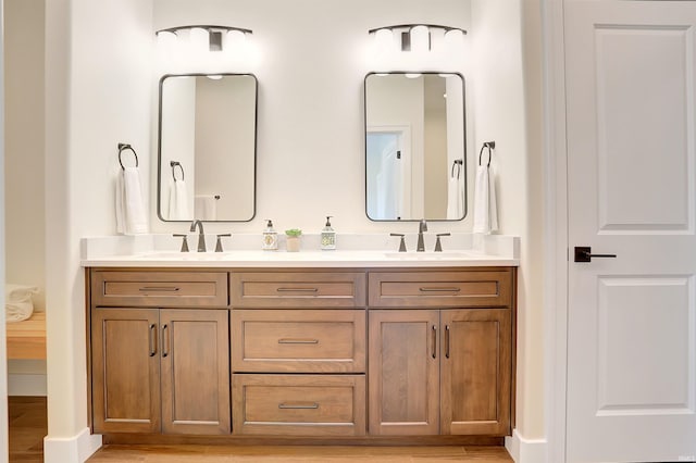 bathroom with vanity and hardwood / wood-style floors