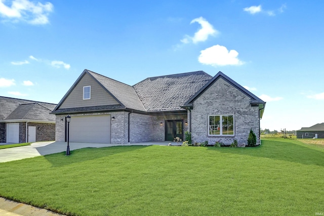 view of front of house with a front yard and a garage