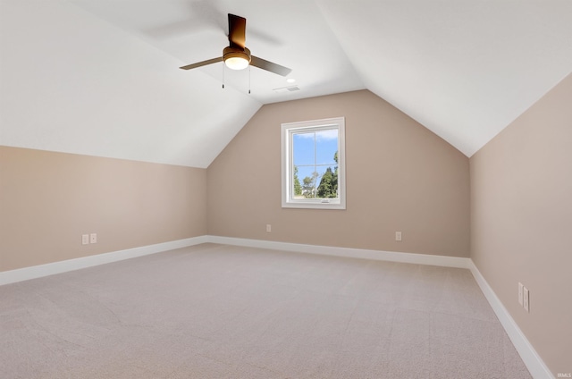 bonus room with ceiling fan, vaulted ceiling, and carpet floors