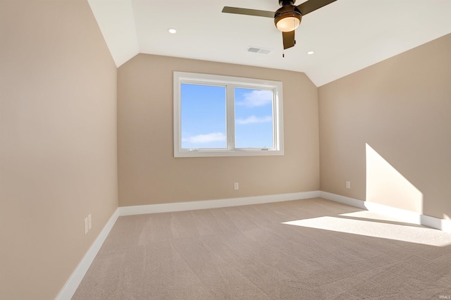 4711 Lemon Grass Ct, Evansville, IN 47725 - empty room with visible vents, a ceiling fan, baseboards, and vaulted ceiling