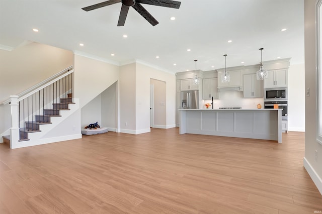 4711 Lemon Grass Ct, Evansville, IN 47725 - unfurnished living room featuring stairs, baseboards, recessed lighting, a ceiling fan, and light wood finished floors