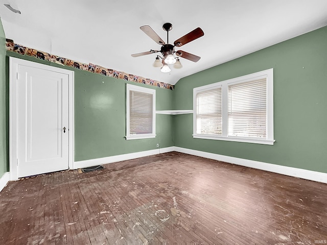 empty room with dark wood-type flooring and ceiling fan