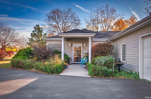 entrance to property featuring a porch