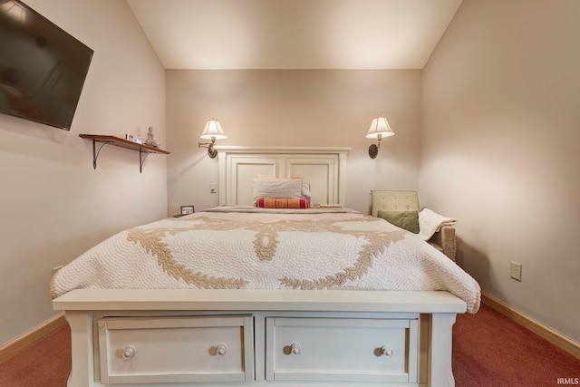 bedroom with carpet floors and vaulted ceiling