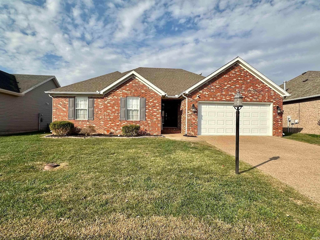 ranch-style house with a front yard and a garage