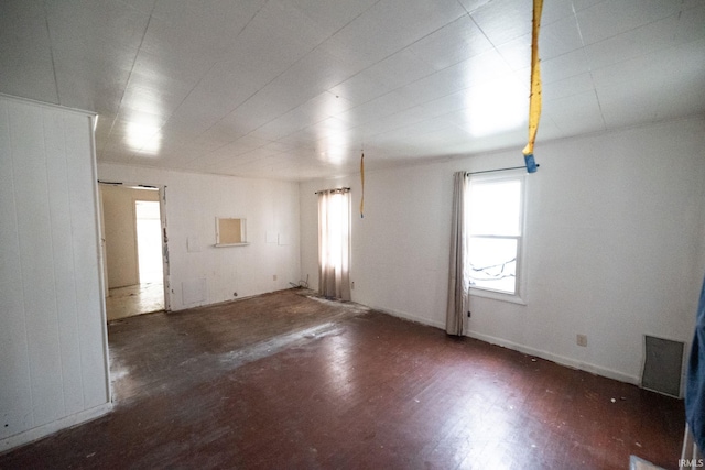 unfurnished room featuring dark hardwood / wood-style floors