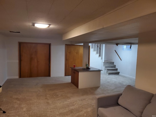 basement featuring light colored carpet