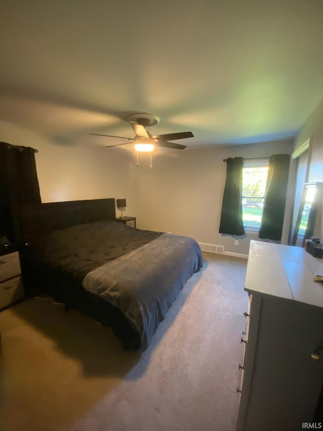 bedroom featuring ceiling fan and carpet flooring