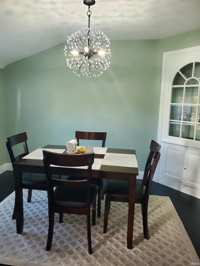 dining area featuring an inviting chandelier