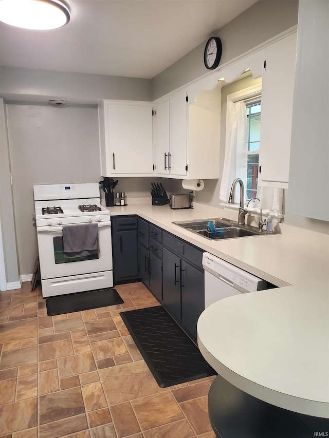 kitchen featuring gray cabinets, white cabinetry, sink, and white appliances