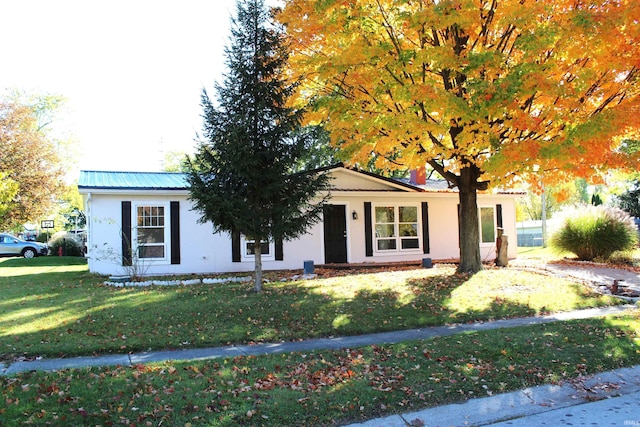 308 Clyde Ave, Angola, IN 46703 - ranch-style house with metal roof and a front lawn