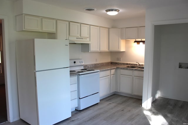 kitchen with sink, white cabinets, light hardwood / wood-style floors, and white appliances